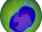 FILE - In this NASA false-color image, the blue and purple shows the hole in Earth's protective ozone layer over Antarctica on Oct. 5, 2022. Earth's protective ozone layer is slowly but noticeably healing at a pace that would fully mend the hole over Antarctica in about 43 years, a new United Nations report says.