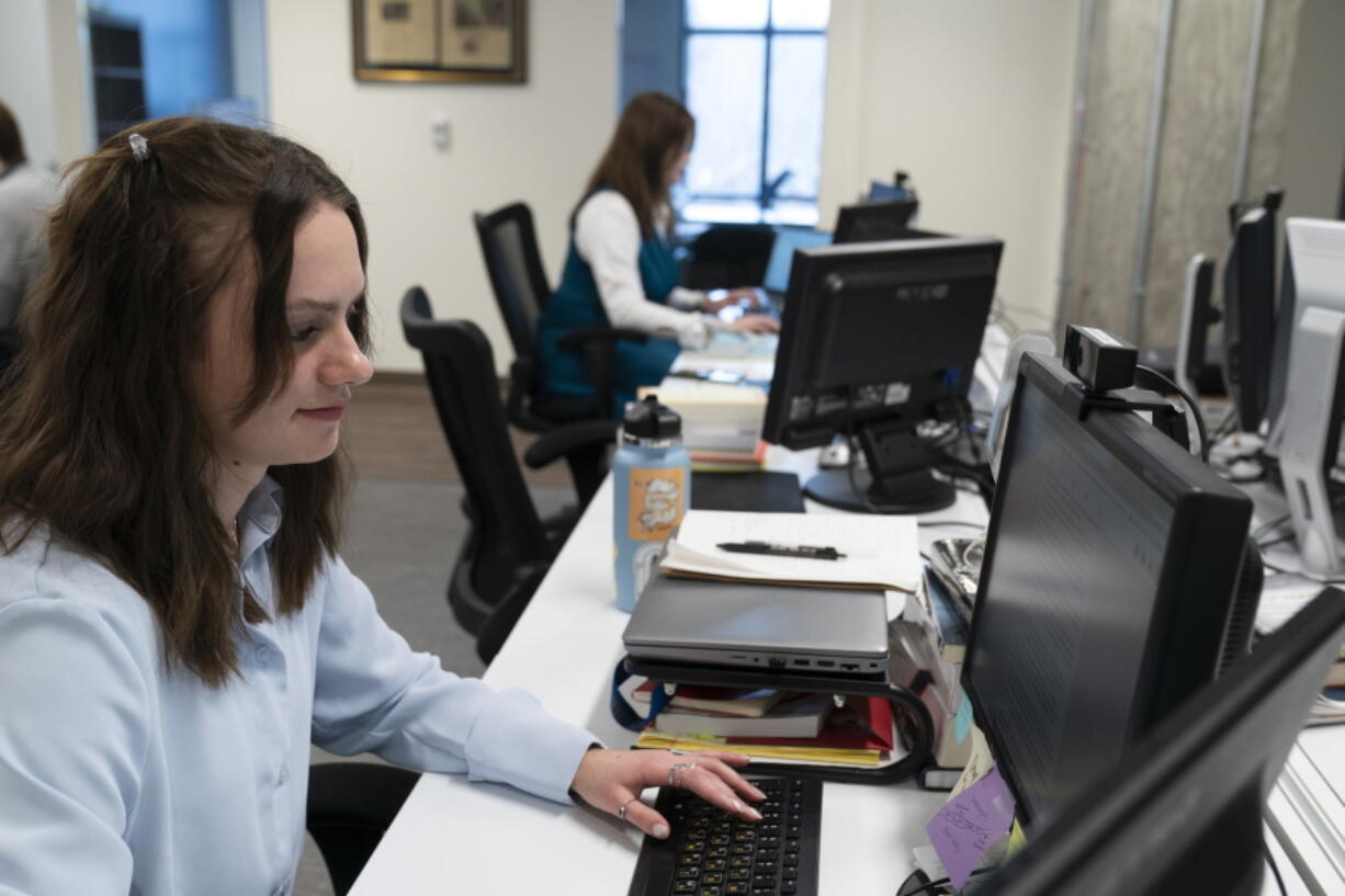 Karolina Hird, a Russia Analyst, works at her desk at the Institute for the Study of War, Wednesday, Jan. 11, 2023, in Washington.