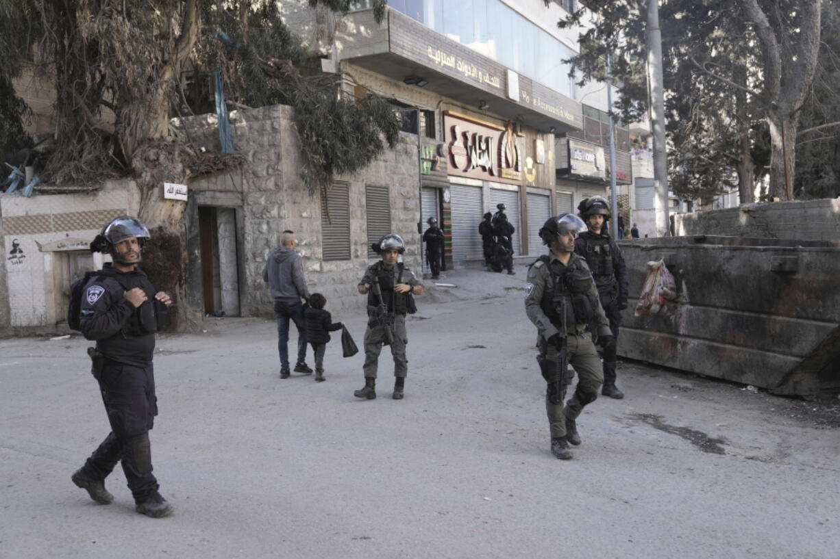 Israeli security forces are deployed in the the village of Anata in east Jerusalem, the hometown of Palestinian gunman Uday Tamimi, Wednesday, Jan. 25, 2023. Israeli forces on Wednesday demolished the home of  Tamimi who allegedly killed a female Israeli soldier in an attack last year that sparked a manhunt and clampdown on the east Jerusalem neighborhood where he lived.