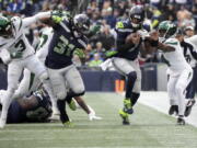 Seattle Seahawks safety Johnathan Abram (23) breaks up a pass intended for New York Jets wide receiver Corey Davis (84) during the second half of an NFL football game, Sunday, Jan. 1, 2023, in Seattle. (AP Photo/Godofredo A.