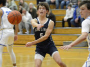 Ryan Tyler (5) of King’s Way Christian makes a pass during a Trico League boys basketball game at La Center High School on Friday, Jan. 27, 2023.