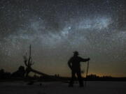 Dave Cooke observes the Milky Way over a frozen fish sanctuary in central Ontario, Canada,  early March 21, 2022. According to research published in the journal Science on Thursday, every year the night sky grows brighter, and the stars look dimmer.