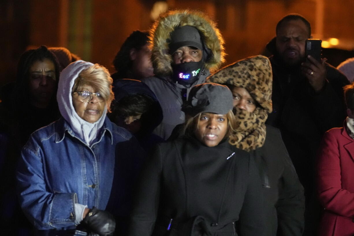 Rodney Wells, center, stepfather of Tyre Nichols, listens to speakers at a prayer gathering at the site where Nichols  was beaten by Memphis police officers, and later died from his injuries, in Memphis, Tenn., Monday, Jan. 30, 2023.