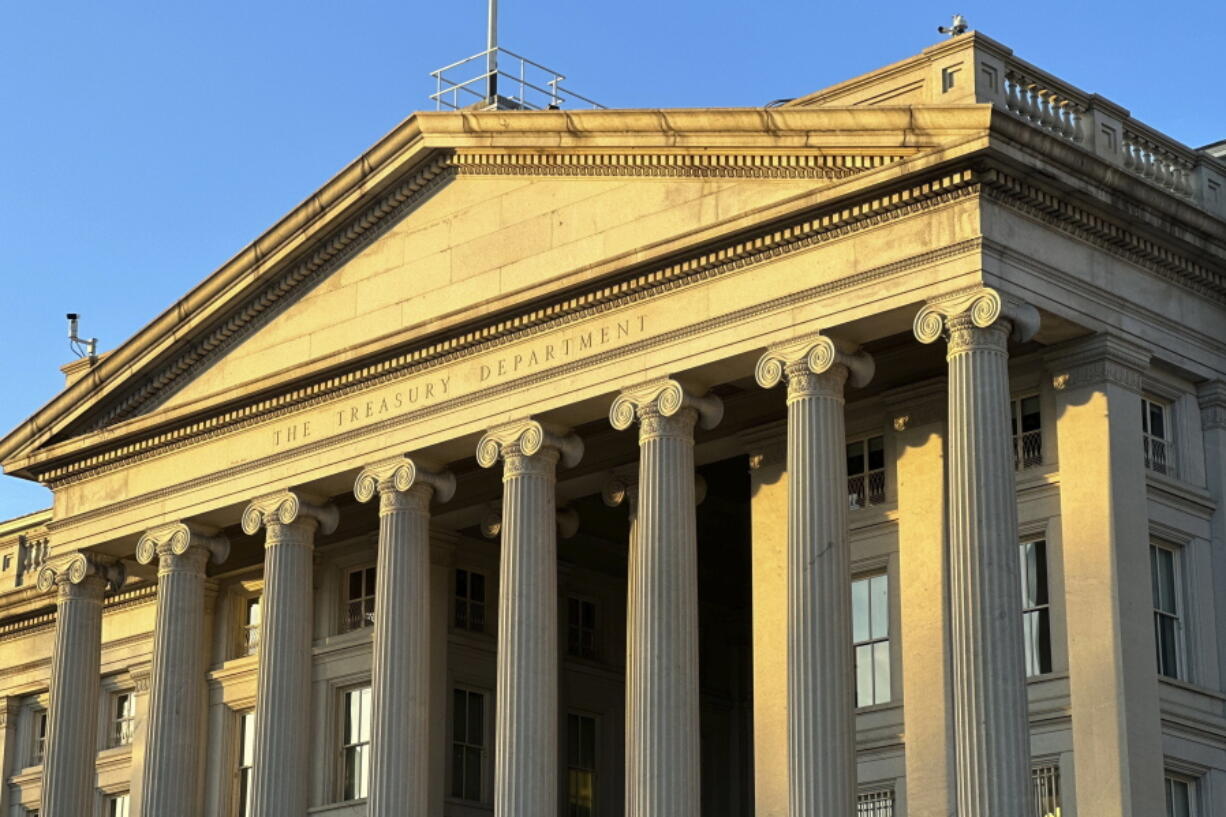 FILE - The Treasury Department is seen near sunset in Washington, Jan. 18, 2023. The national debt is at the core of a dispute about how to raise the government's legal borrowing authority, which could come to a head this summer if the government runs out of accounting maneuvers to keep paying its bills.