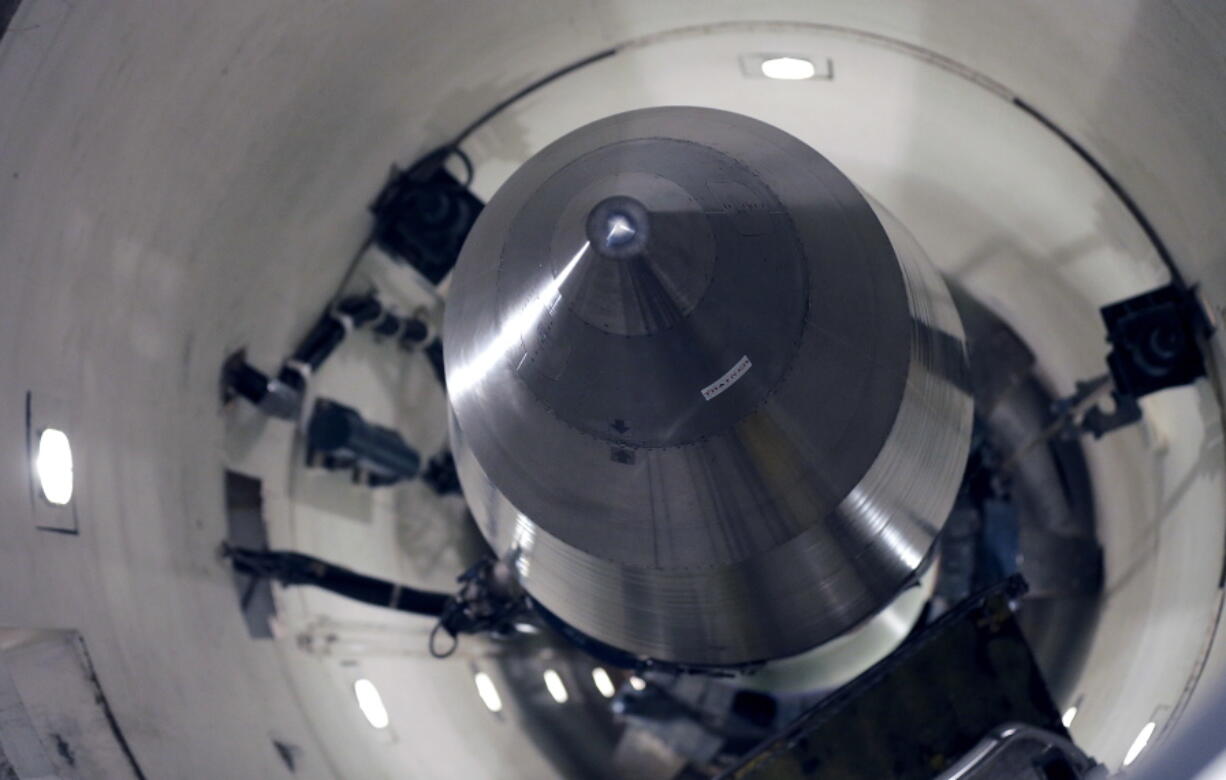 FILE - An inert Minuteman III missile is seen in a training launch tube at Minot Air Force Base, N.D., June 25, 2014. Nine military officers who had worked decades ago at a nuclear missile base in Montana, home to a vast field of 150 Minuteman III intercontinental ballistic missile silos, have been diagnosed with blood cancer and there are "indications" the disease may be linked to their service, according to military briefing slides obtained by The Associated Press. One of the officers has died.