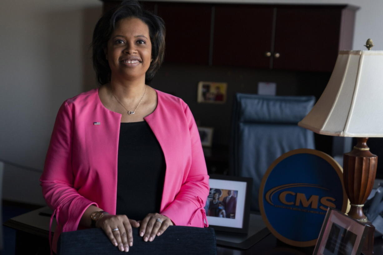 FILE - Chiquita Brooks-LaSure, the Administrator for the Centers of Medicare and Medicaid Services, poses for a photograph in her office, Feb. 9, 2022, in Washington. The federal government will allow Medicaid dollars to treat people in prisons, jails or juvenile detention centers for the first time ever, the Centers for Medicare and Medicaid Services announced Jan. 26, 2023. The move will provide more stability for inmates and juvenile detainees as they exit institutions and re-enter the outside world, said Brooks-LaSure.