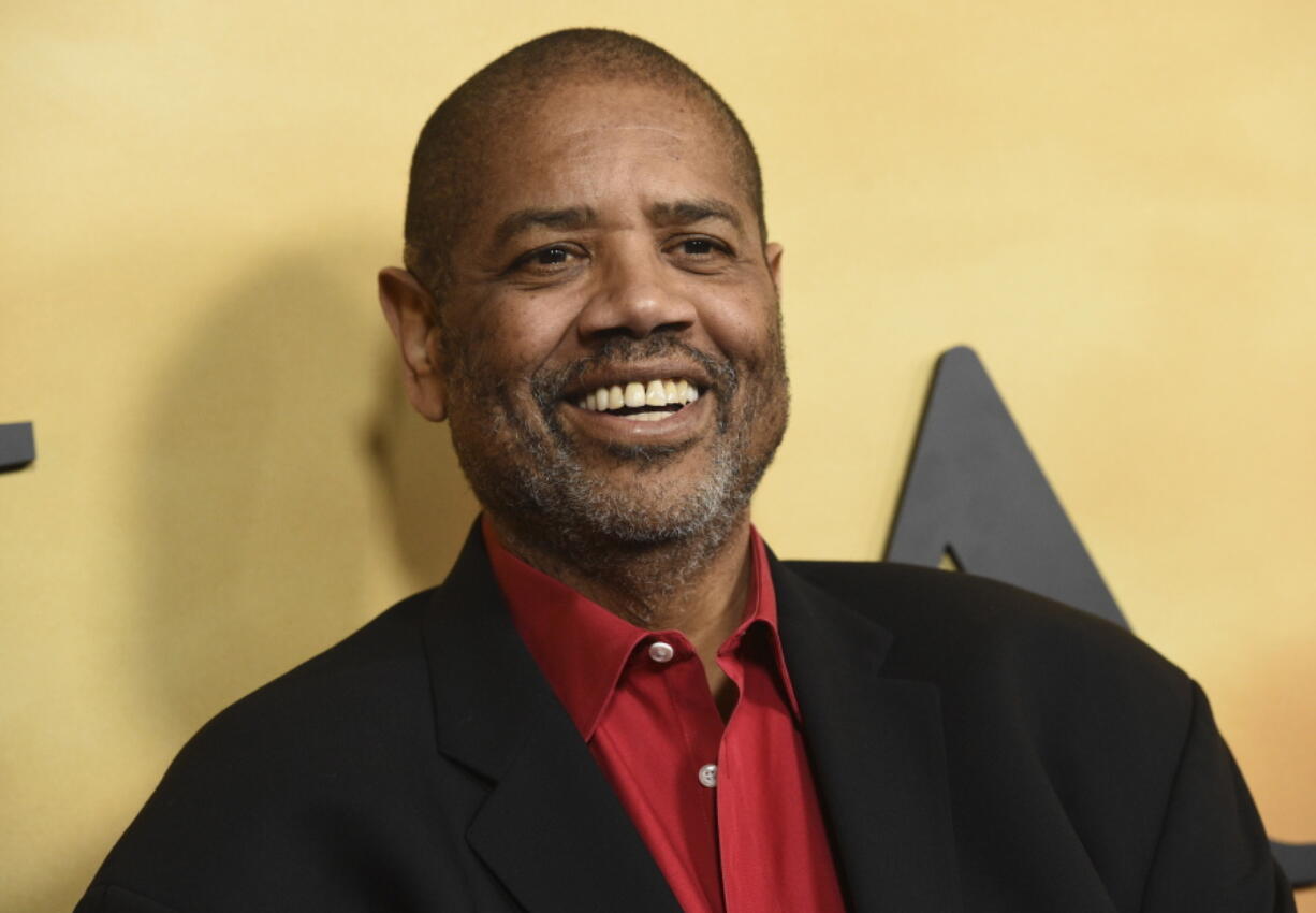 FILE - Gregory Allen Howard arrives at the Los Angeles premiere of "Harriet" on Oct. 29, 2019.  Howard, who skillfully adapted stories of historical Black figures in "Remember the Titans" starring Denzel Washington, "Ali" with Will Smith and "Harriet" with Cynthia Erivo, died Friday at a hospital in Miami of heart failure, according to publicist Jeff Sanderson. He was 70.