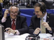 CBS announcers Billy Packer, left, and Jim Nantz laugh during a break in the championship game in the Big Ten basketball tournament in Indianapolis, March 12, 2006. Packer, an Emmy award-winning college basketball broadcaster who covered 34 Final Fours for NBC and CBS, died Thursday night, Jan. 26, 2023, of kidney failure. He was 82.