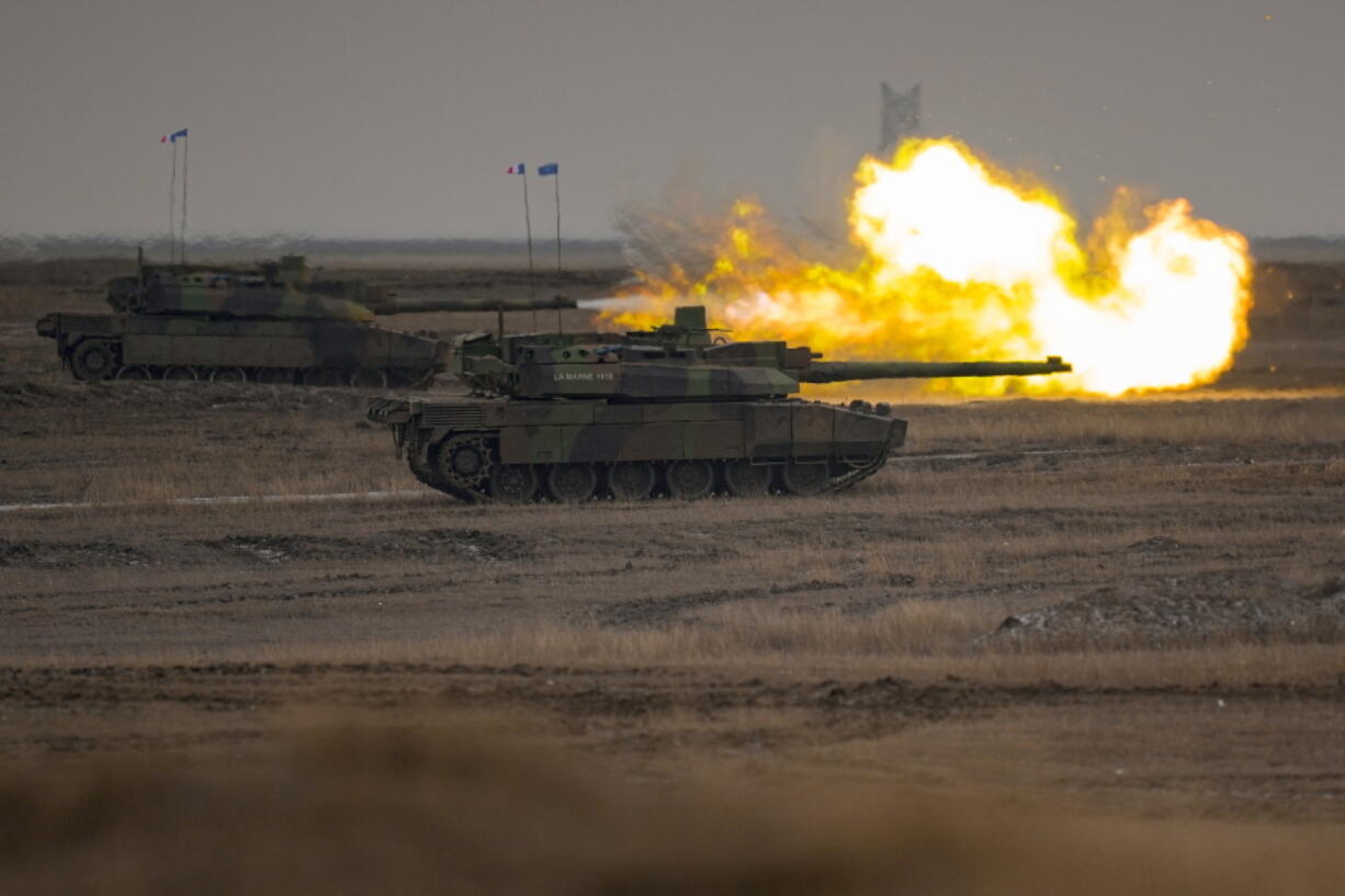 A French Leclerc main battle tank shoots during an exercise at a training range in Smardan, eastern Romania, Wednesday, Jan. 25, 2023. Around 600 French soldiers deployed to Romania as part of a NATO battlegroup on the alliance's eastern flank carried out live combat exercises on Wednesday to test their preparedness amid Russia's ongoing war in neighboring Ukraine.