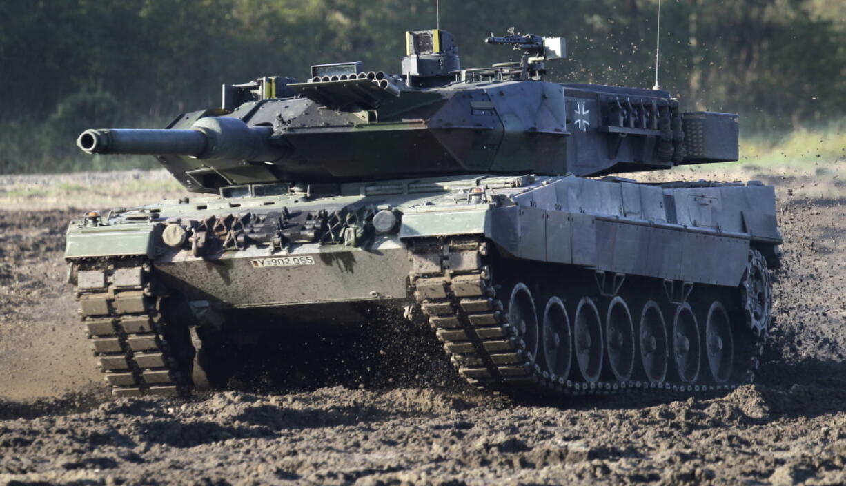 FILE - A Leopard 2 tank is pictured during a demonstration event held for the media by the German Bundeswehr in Munster near Hannover, Germany, Wednesday, Sept. 28, 2011. Chancellor Olaf Scholz is expected to announce Wednesday, Jan. 25, 2023 that his government will approve supplying German-made battle tanks to Ukraine. The long-awaited decision comes after U.S. officials said Tuesday that a preliminary agreement had been struck for the United States to send M1 Abrams tanks to help Kyiv push back Russian forces entrenched in the east almost a year since the start of the war.