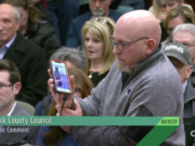 Mark Krant plays recorded audio of a light cement plant at the Port of Vancouver for the Clark County Council on Tuesday night. Residents packed council chambers Tuesday night to protest a cement plant that has been proposed north of 179th Avenue and east of the Meadow Glade area.