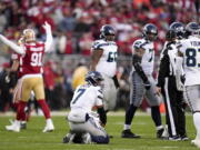 Seattle Seahawks quarterback Geno Smith (7) reacts after losing a fumble against the San Francisco 49ers during the second half of an NFL wild card playoff football game in Santa Clara, Calif., Saturday, Jan. 14, 2023. (AP Photo/Godofredo A.