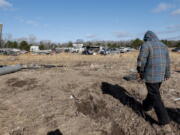 David Hollon walks his property looking for personal items as they recover from a tornado that ripped through Central Alabama earlier this week along County Road 140 where loss of life occurred Saturday, Jan. 14, 2023, in White City, Autauga County, Ala.