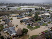 Flooding from huge amounts of rain are seen in a neighborhood off of Holohan Road near Watsonville, Calif. on Monday, Jan. 9, 2023.(Bront?