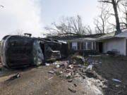 A vehicle is upended and debris is strewn about follow a tornado near Meadowview elementary school Wednesday, Jan. 12, 2023 in Selma Ala.