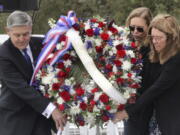 A wreath is presented by, from left, Bob Cabana, Associate Administrator of NASA; Janet Petro, NASA KSC director, and Sheryl Chaffee, daughter of Apollo 1 astronaut Roger Chaffee, during NASA's Day of Remembrance ceremony, hosted by the Astronauts Memorial Foundation at Kennedy Space Center Visitor Complex, Thursday, Jan. 26, 2023. NASA is marking the 20th anniversary of the space shuttle Columbia tragedy with somber ceremonies during its annual tribute to fallen astronauts.