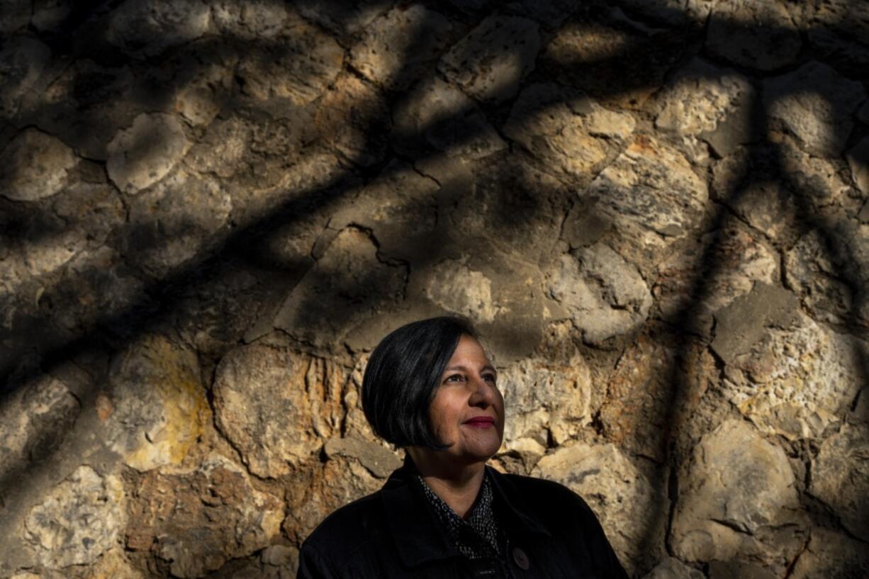 President of the opposition-controlled National Assembly of Venezuela Dinorah Figuera poses for a photo during and interview with the Associated Press in Valencia, southeast Spain, Thursday, Jan. 12, 2023. These days Figuera hustles to make ends meet working as an in-home caregiver for an elderly diabetic woman in the Mediterranean port city of Valencia.