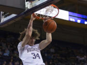 Washington center Braxton Meah dunks during the second half of the team's NCAA college basketball game against Stanford Thursday, Jan. 12, 2023, in Seattle.