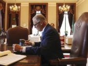 Washington Gov. Jay Inslee prepares his 2023 State of the State address at the Capitol in Olympia, Wash., on Tuesday, Jan. 10, 2023.