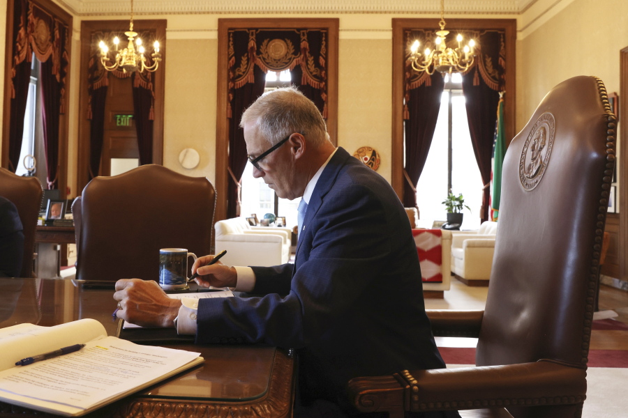 Washington Gov. Jay Inslee prepares his 2023 State of the State address at the Capitol in Olympia, Wash., on Tuesday, Jan. 10, 2023.