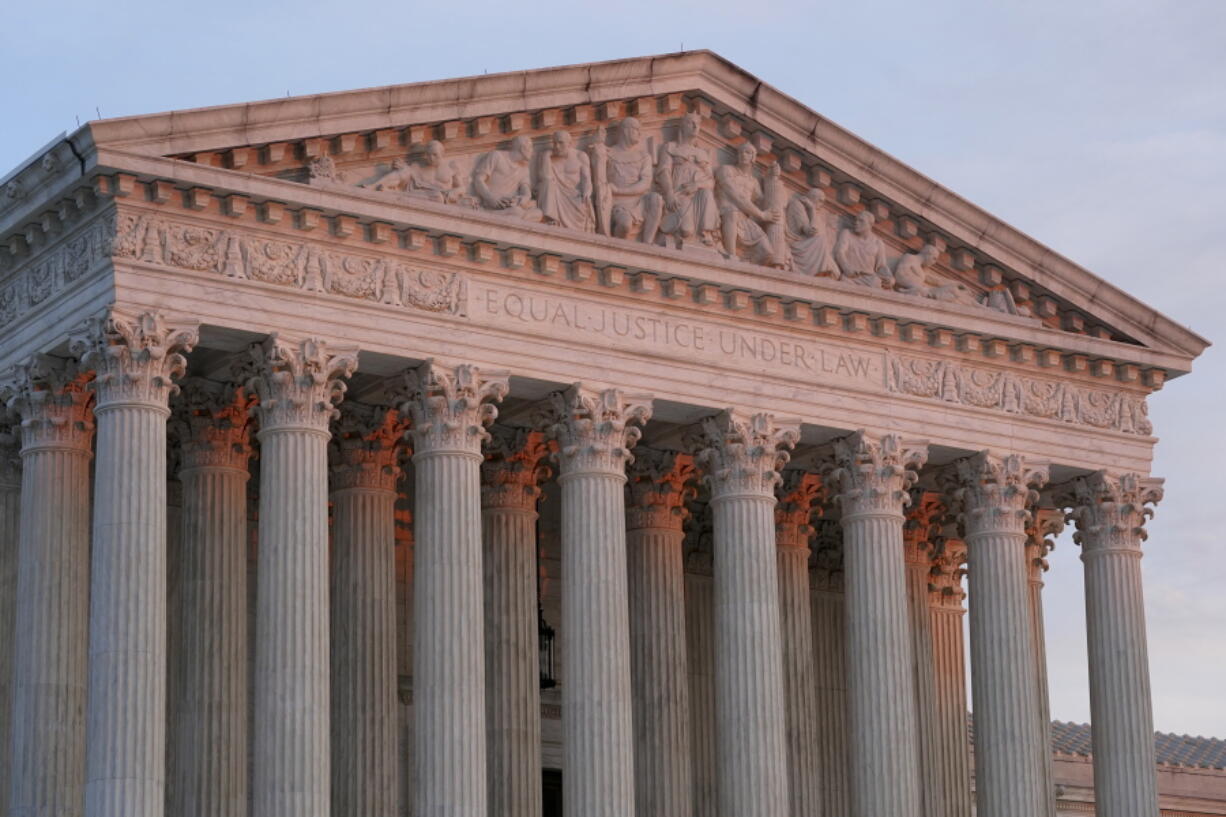 FILE - The setting sun illuminates the Supreme Court building on Capitol Hill in Washington, Jan. 10, 2023. The Supreme Court on Friday, Jan. 13, agreed to consider what employers must do to accommodate religious employees, among eight new cases it added.