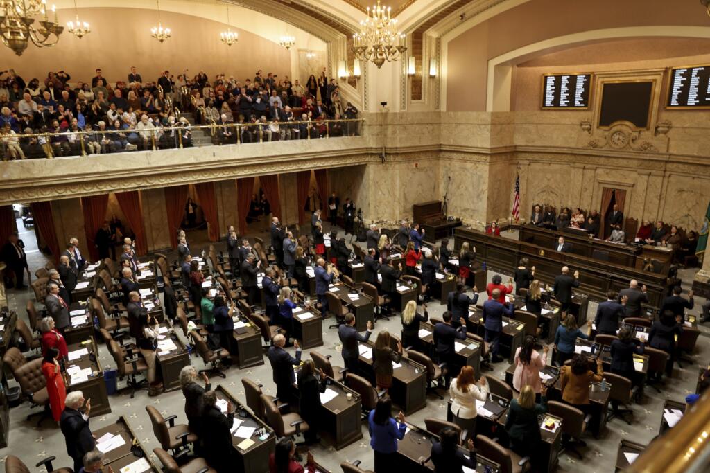 Legislators swear in on the first day of the legislative session at the Washington state Capitol in Olympia, Wash., on Monday, Jan. 9, 2023.