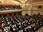 Legislators swear in on the first day of the legislative session at the Washington state Capitol in Olympia, Wash., on Monday, Jan. 9, 2023.