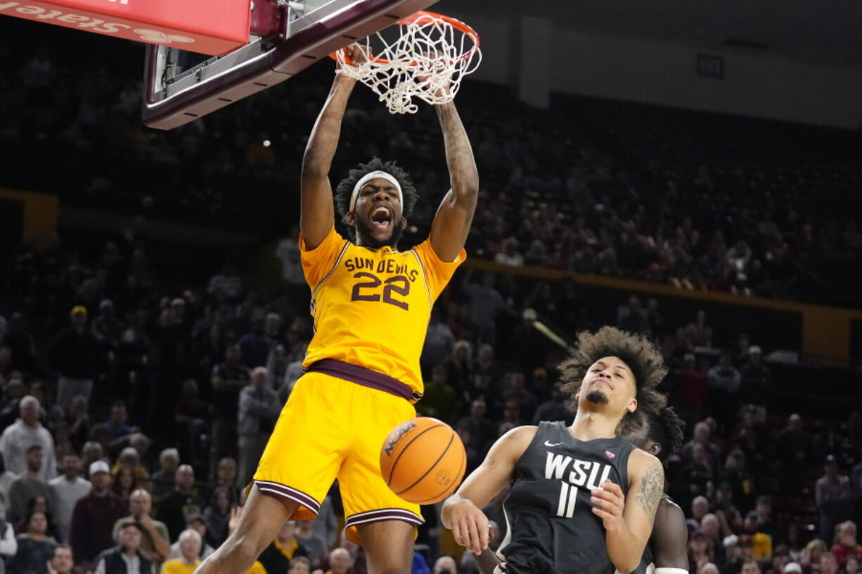 Arizona State forward Warren Washington (22) dunks against Washington State forward DJ Rodman (11) during the second half of an NCAA college basketball game in Tempe, Ariz., Thursday, Jan. 5, 2023. Arizona State won 77-71. (AP Photo/Ross D.