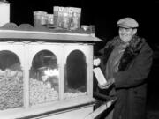 John Spiropoulos doesn't let a coal strike bother his peanut and popcorn business as he uses gasoline for light and heat at North Avenue and Clark Street on Nov. 25, 1946, in Chicago.