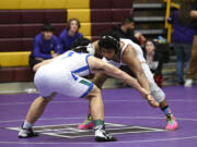 Prairie's Alex Ford, right, and Mountain View's Elijah Mar wrestle in the 170-pound championship match at the Class 3A Greater St. Helens League district wrestling championships on Saturday, Feb. 4, 2023 at Prairie High School.