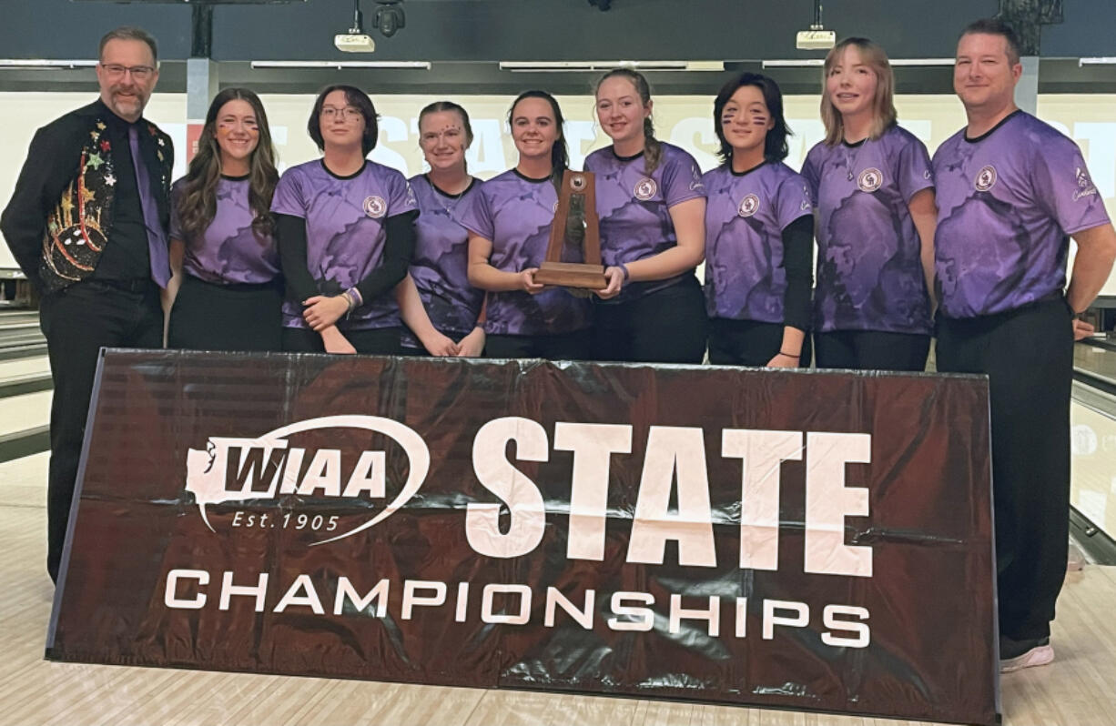 Columbia River bowlers and coaches pose for photos with their second-place trophy at the 1A/2A state championships on Saturday at Bowlero in Tukwila. The Rapids? senior class of six earned three runner-up state finishes in four seasons.