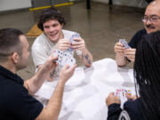 Shawn Crump, 31, plays cards with correctional officers from Stafford Creek Corrections Center on Wednesday, Jan. 18, 2023 in Aberdeen. In the Amend program, incarcerated individuals are able to take an hour or two to play games, talk or learn about ways to apply themselves when they???re released.