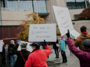 Human services workers gather in Seattle City Hall plaza to rally for increased wages that will cover inflation, at a minimum, on Tuesday, November 8, 2022.