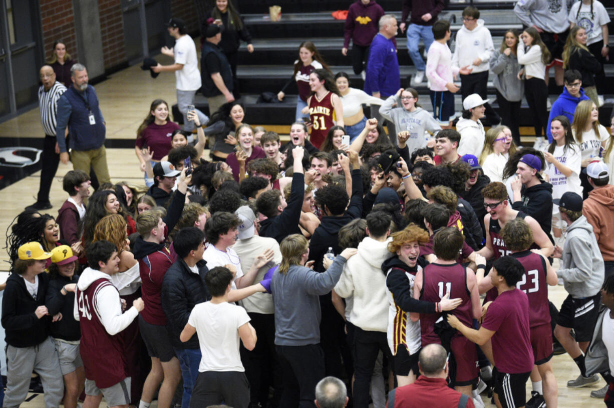 Prairie players and students celebrate the Falcons' 30-29 win over Evergreen in a 3A Greater St. Helens League tiebreaker at Union High School on Monday, Feb. 6, 2023.