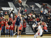 Skyview’s Sam Groesbeck, left, puts in a layup following a steal in the open court against Union on Tuesday, Feb. 7, 2023, at Union High School.