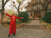 Mary Tyler Moore tossing her hat up as she revisits the Minneapolis Kenwood neighborhood house that was her television "home" for the television show "The Mary Tyler Moore Show" in 1996. (Cheryl A.