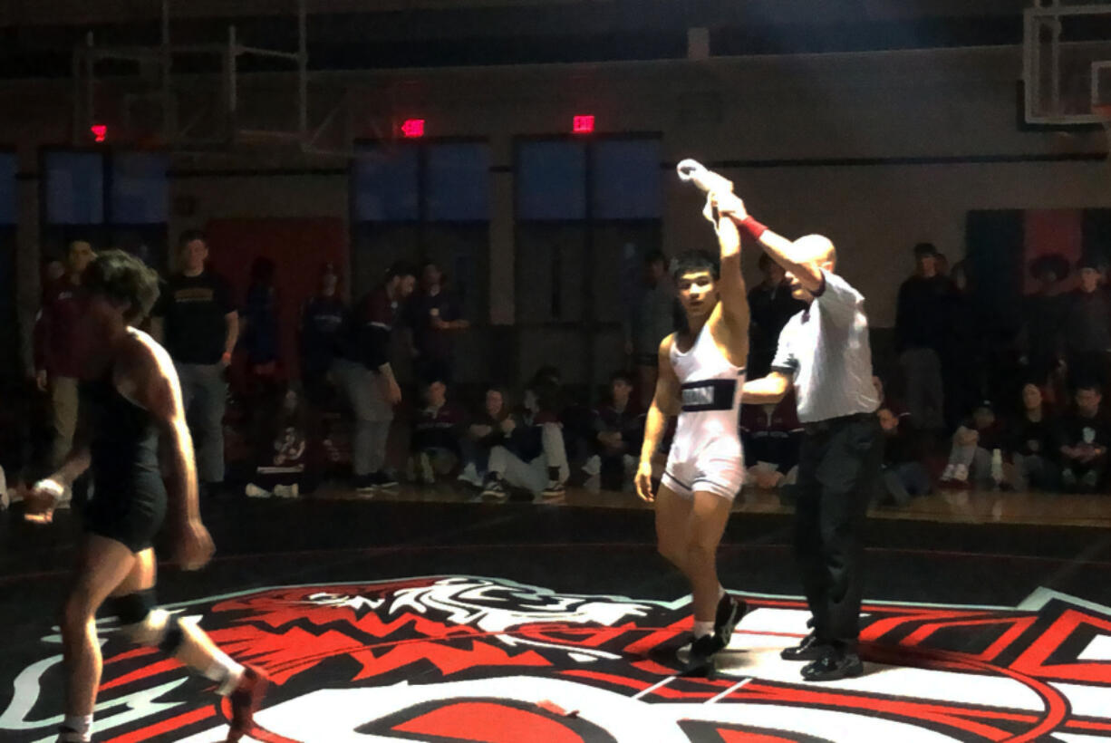 Union sophomore Noah Koyama has his hand raised after beating South Kitsap's Stone Hartford to win the 132-pound title at the Class 4A Region 3 Wrestling Championships on Saturday at Battle Ground High School (Micah Rice/The Columbian)