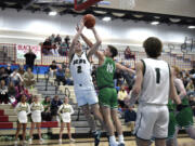 Woodland’s Justin Philpot goes up for a shot against Tumwater on Thursday, Feb. 16, 2023, at Mark Morris High School in Longview.