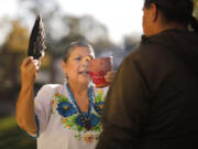 Grace Sesma, a curandera, leads a spiritual cleansing with a client at her home in Alpine on November, 22, 2022. (K.C.