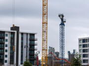 Construction cranes are a common sight at the Waterfront Vancouver and the Port of Vancouver's neighboring Terminal 1 project this winter, with more to come as remaining blocks are sold and developed.