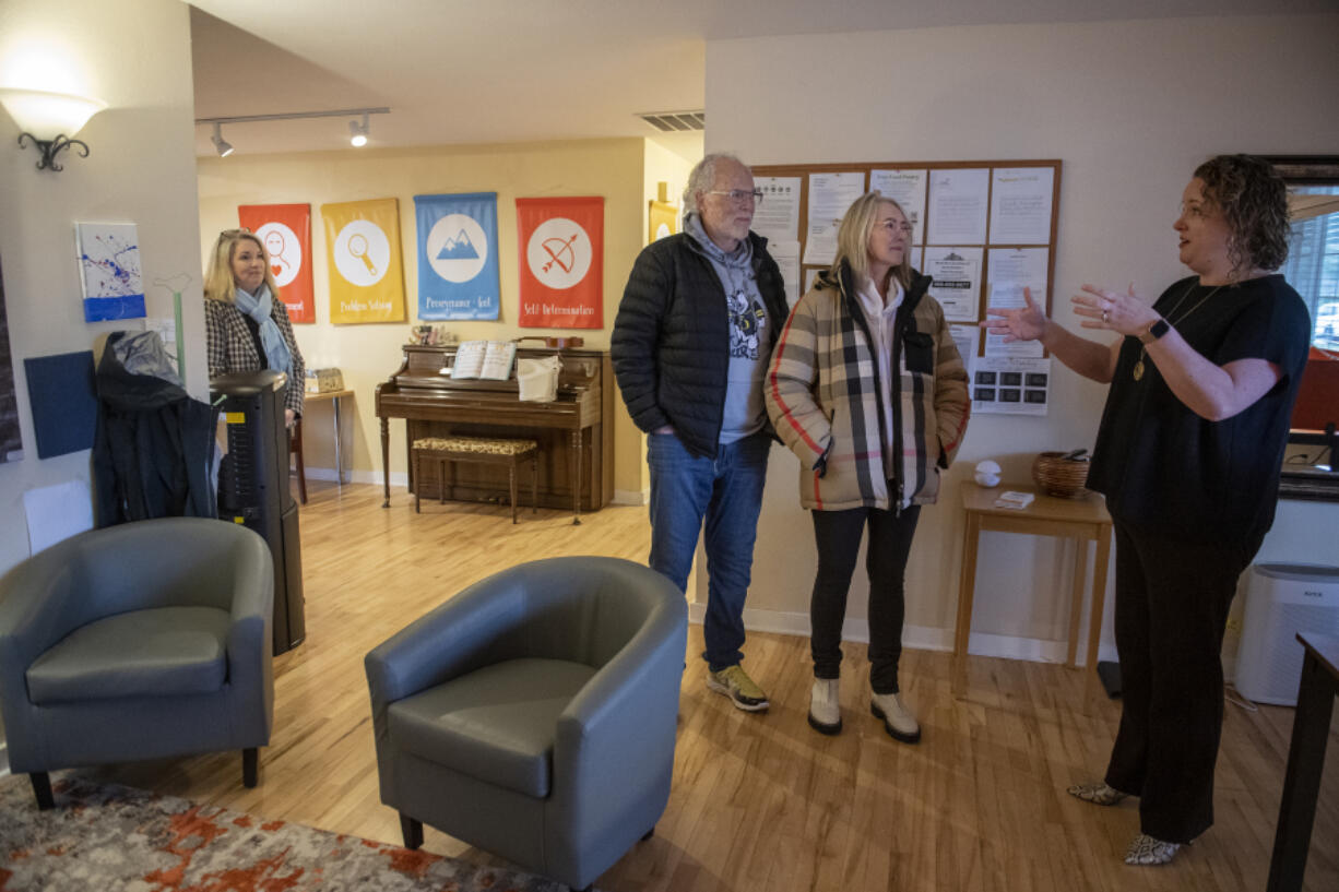 Kate Sacamano of Friends of the Children Southwest Washington, from left, looks on as philanthropists Gary and Christine Rood talk with Allison Pauletto during a tour of the clubhouse. The Roods recently donated $33 million to the national organization, $5 million of which will go toward building a new clubhouse for the Southwest Washington chapter.