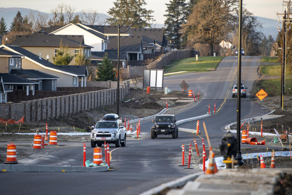 Cars snake through a construction zone at the intersection of South Royle Road and South 15th Street in Ridgefield. Residents say it's difficult to drive on, especially at night.