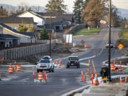 Cars snake through a construction zone at the intersection of South Royle Road and South 15th Street in Ridgefield. Residents say it's difficult to drive on, especially at night.