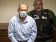 Suspected serial killer Warren Forrest, left, is escorted by corrections officers into the courtroom Wednesday, Feb. 1, 2023, at the Clark County Courthouse. Forrest is charged with first-degree murder in the killing of 17-year-old Martha Morrison of Portland in 1974.