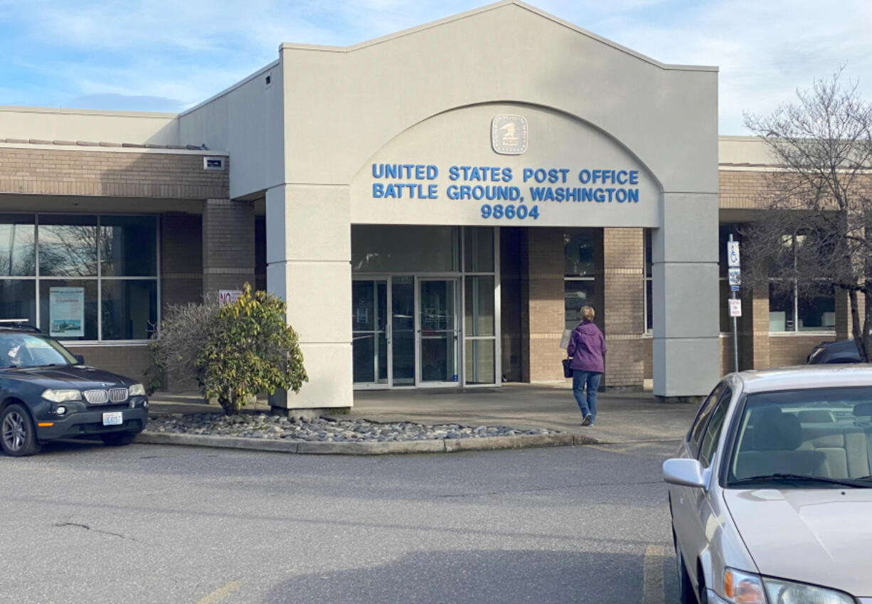 A customer walks into the Battle Ground Post Office Wednesday morning. An ongoing shortage of carriers has left many residents with missed or late deliveries.