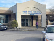 A customer walks into the Battle Ground Post Office Wednesday morning. An ongoing shortage of carriers has left many residents with missed or late deliveries.