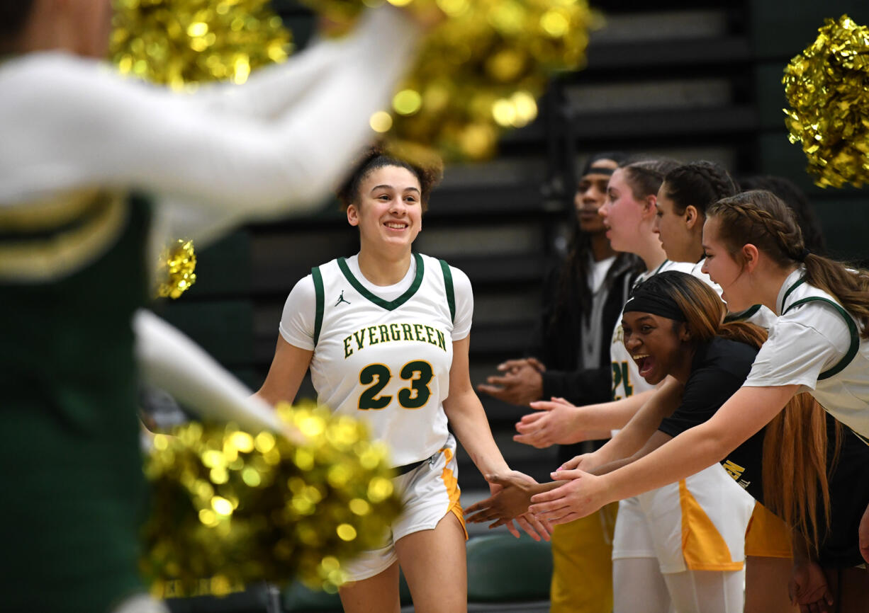 Evergreen sophomore Adrian Wright, center, smiles during player introductions Friday, Feb. 10, 2023, before the Plainsmen’s game against North Thurston at Evergreen High School.