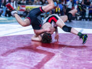 Camas’ Simon Jarrell, 160 pounds, competes against Sunnyside’s John Rendon in the first round at Mat Classic XXXIV on Friday, February 17, 2023, at the Tacoma Dome.