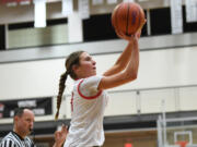 Camas sophomore Sophie Buzzard shoots the ball Friday, Feb. 24, 2023, during the Papermakers' 52-48 win against Kamiakin at Battle Ground High School.