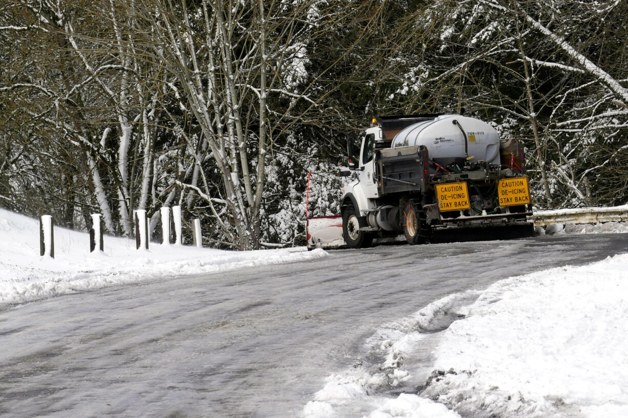 A snowplow travels Northeast Leverich Park Way in Vancouver late Thursday morning, Feb. 23, 2023.